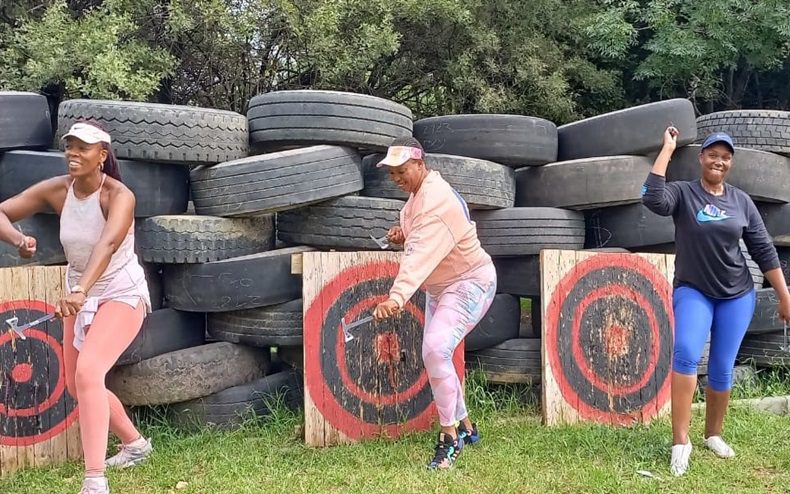 3 Ground Zero participants axe throwing 