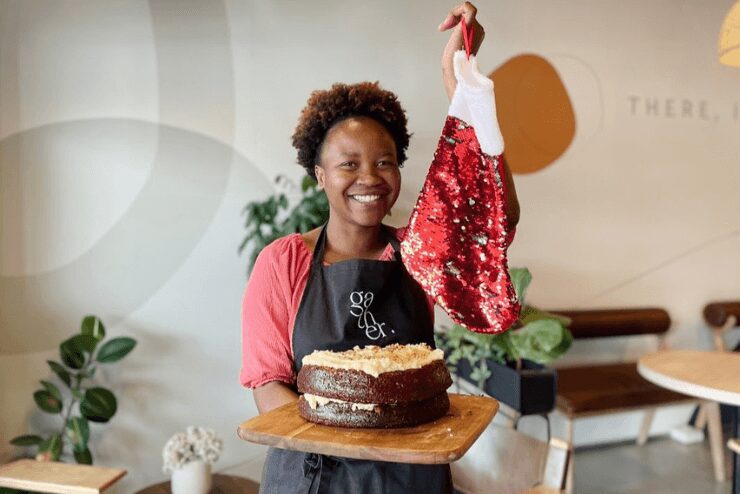 woman holding cake at coffee shop in Johannesburg