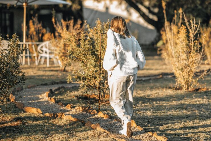 woman walking in pathways at Farmhouse58