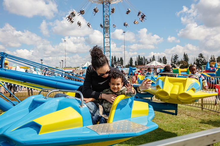 A child on a ride at the Rand Show - Easter Activities for kids