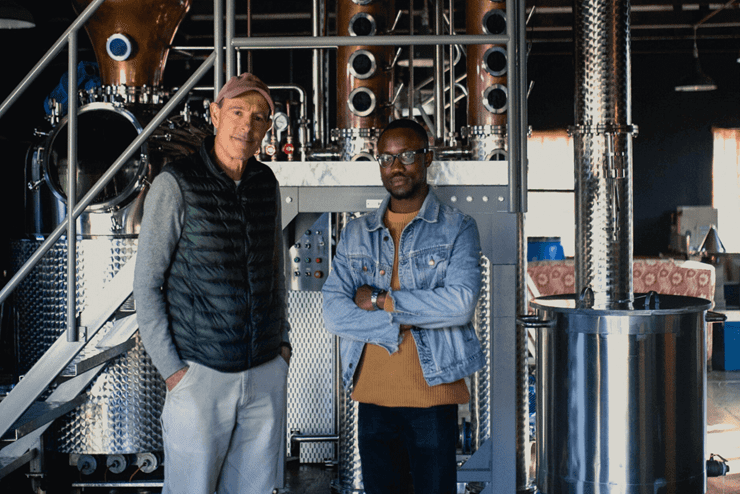 Founder, Tony and distiller, Chris pose in the Primal Distillery