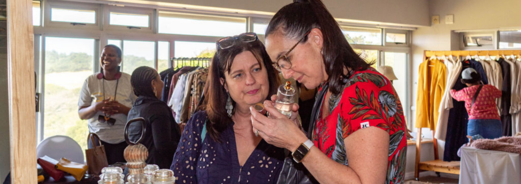 Two ladies smelling scents at the Sip & Shop Pop Up | What's on in Joburg