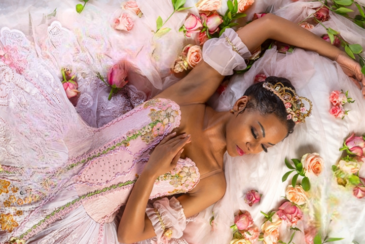 A Joburg Ballet dancer laid down with eyes closed, dressed in pink - Events in Johannesburg