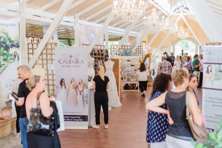 Women standing around wedding stalls