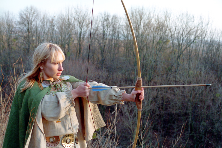 A medieval character shoots bow and arrow - AUgust Events