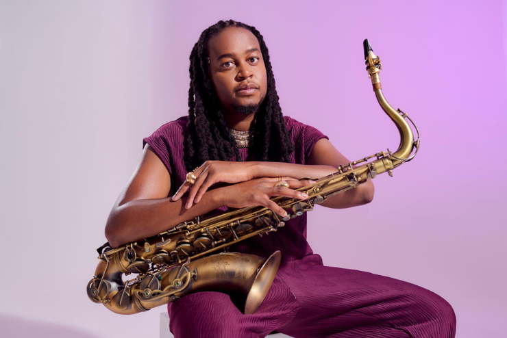 Linda Sikhakhane sitting and holding a saxophone - do this weekend in Joburg