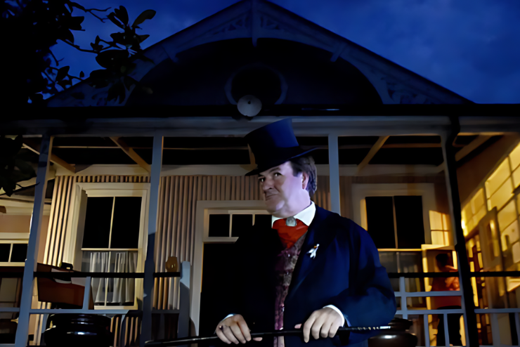 Illusionist and celebrity paranormalist, Mark Rose-Christie in front of a haunted building