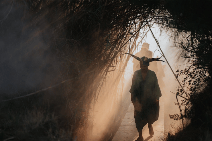 A person walks through a haunted forest