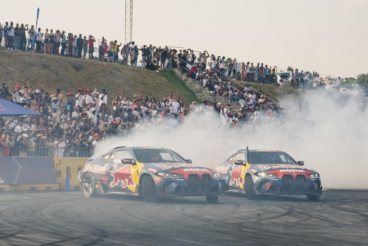 Two BMW's doing a drifting display at BMW M-Fest