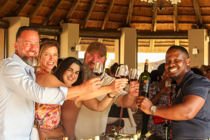 A group toasting wine glasses at BenVino Wine Festival - What's on in Joburg