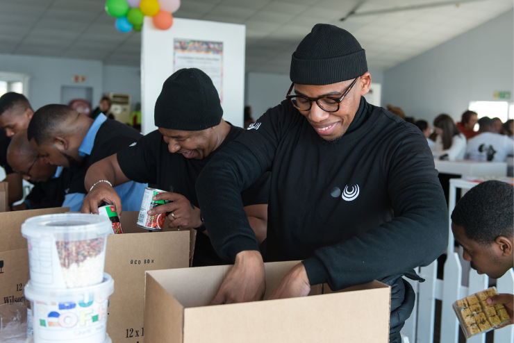 Ladles of Love volunteers packing boxes 